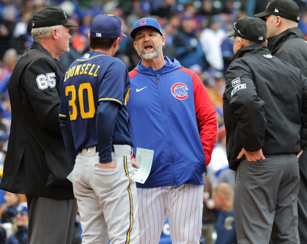 Chicago Cubs manager David Ross and Milwaukee Brewers manager Craig Counsell (30) meet before their game Thursday, April , 2022 at Wrigley Field in Chicago, Ill.