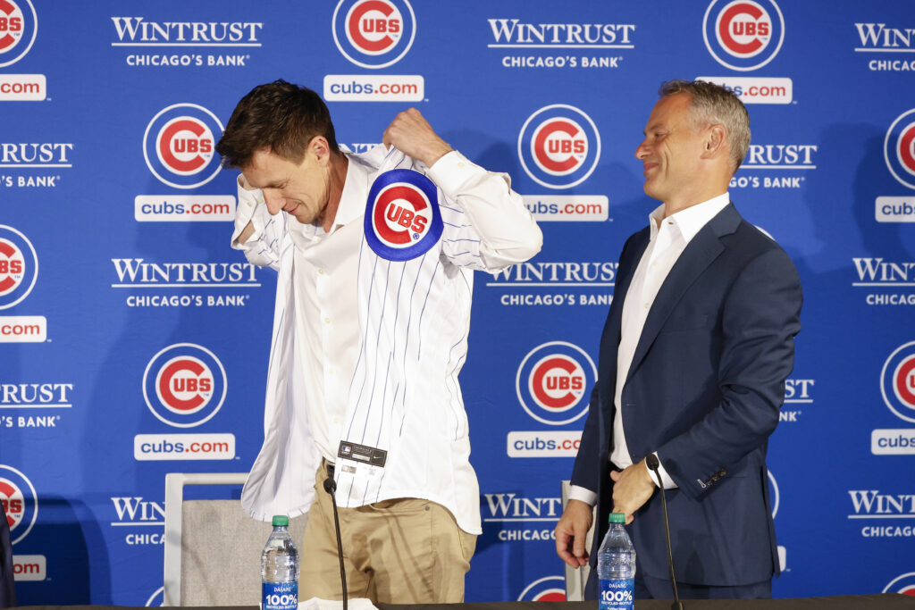 Nov 13, 2023; Chicago, Illinois, USA; Craig Counsell (L) receives Chicago Cubs jersey from Jed Hoyer (R), Cubs President of baseball operations as he is introduced as a new Cubs manager during a press conference in Chicago.
